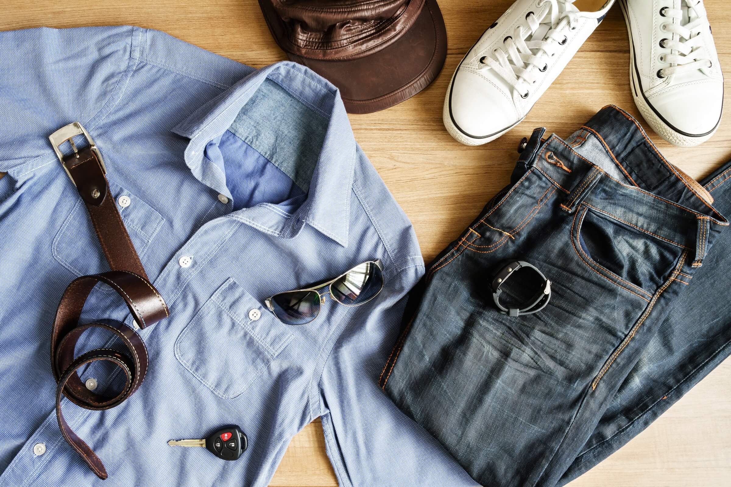 flat-lay-of-men-casual-fashion-outfits-on-wooden-b-P8XWEHX